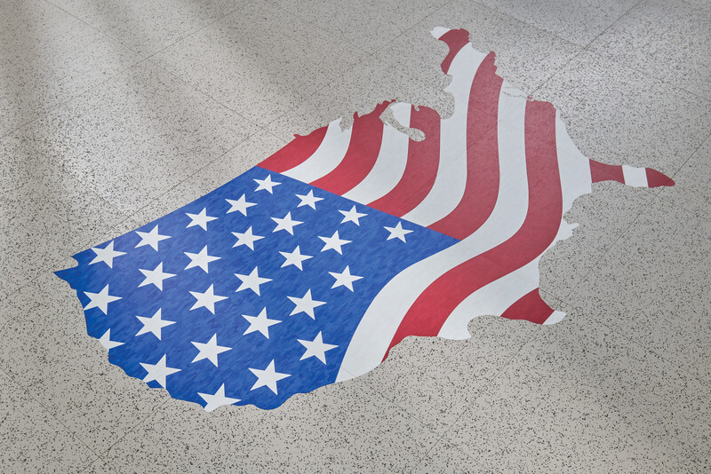 Waterjet cut image of the United States with a flag cut to shape