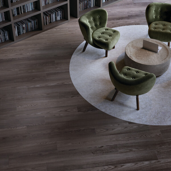 Seating area with a low table and chairs with dark LVT flooring