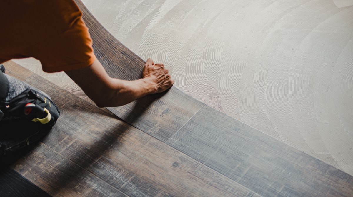 Installer laying wide plank luxury vinyl tile; 7 mistakes to avoid making with commercial installs