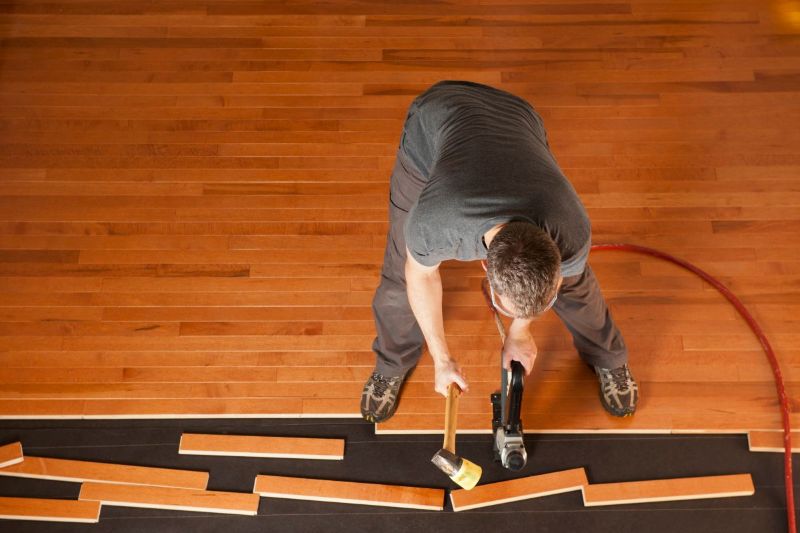 Installer laying LVT flooring; common mistakes made during floor installation