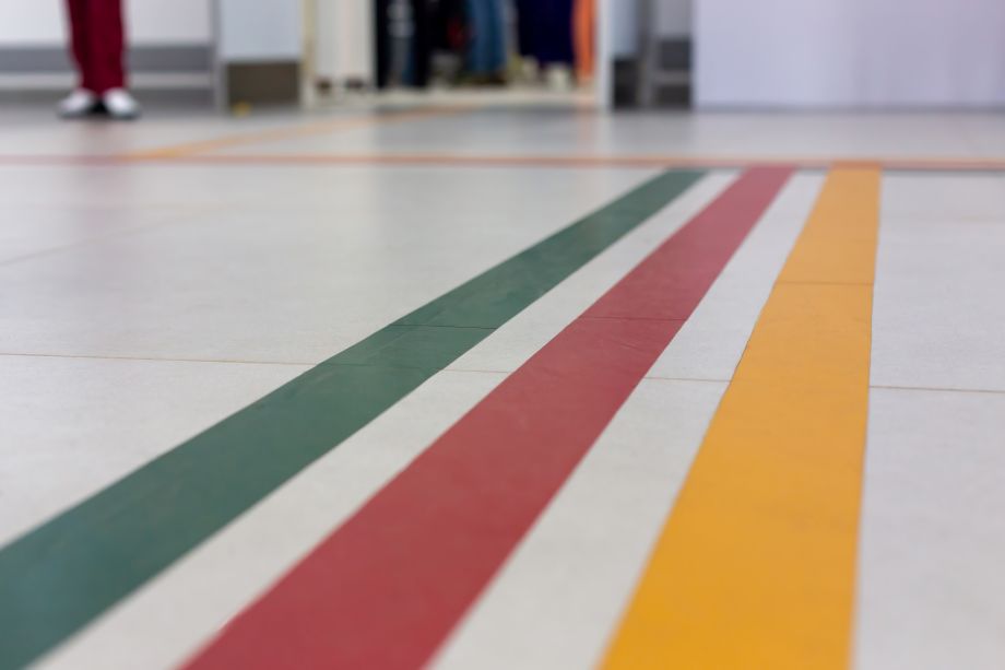 Flooring image with green, red, and yellow lines to show wayfinding design