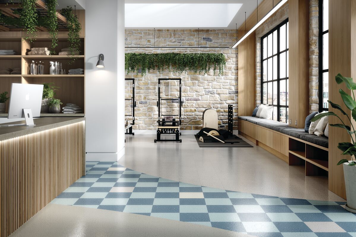 Gym space with weight machines using colorful vinyl composition tile flooring