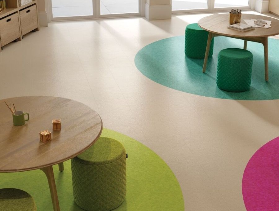 Library area with tables and colorful VCT flooring