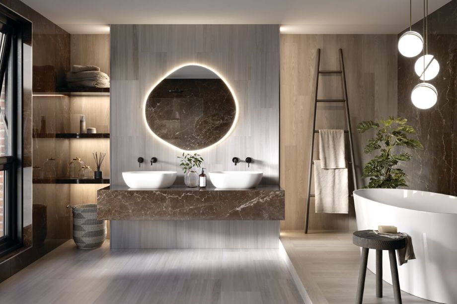 Bathroom with tub and sink using LVT on the floors and walls.